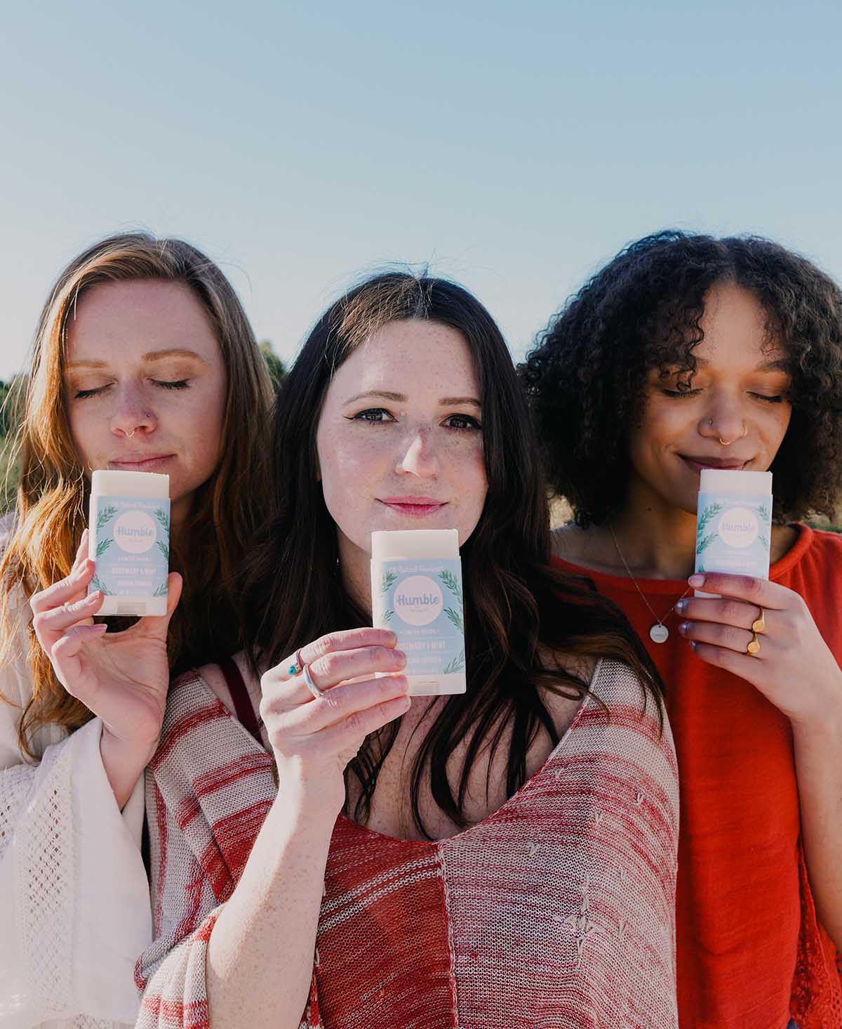 3 women smelling rosemary mint