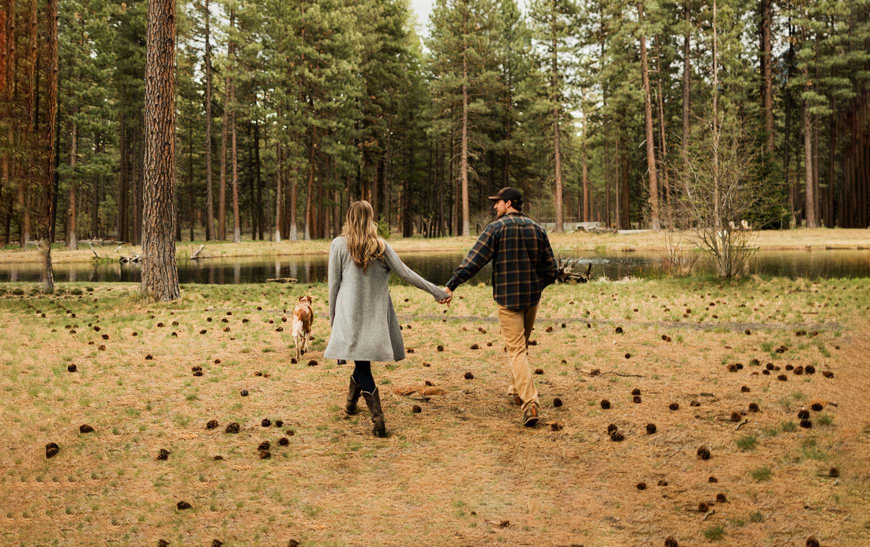 couple in the field of lake creek lodge