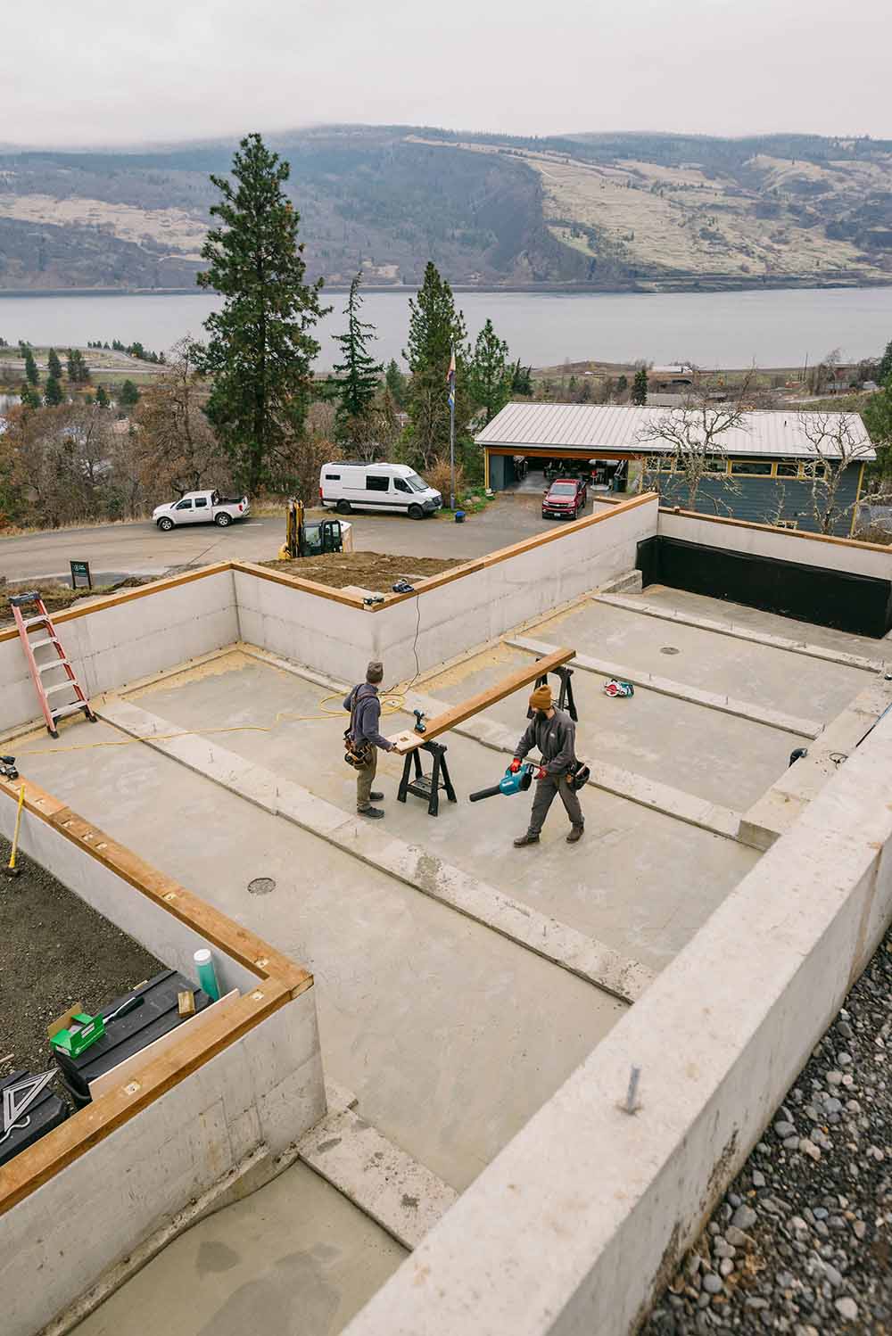 men building a home along the Columbia River in Washington